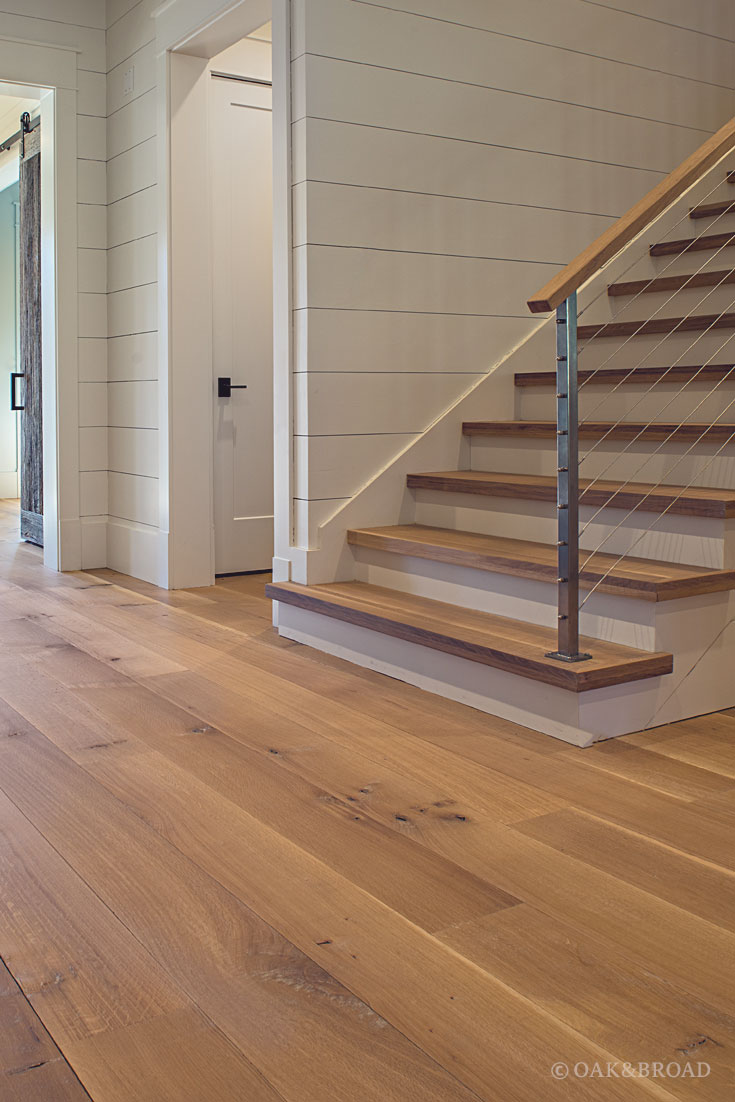 Wide Plank White Oak Hardwood Floor by Oak and Broad with Custom Stain | Matching stair treads