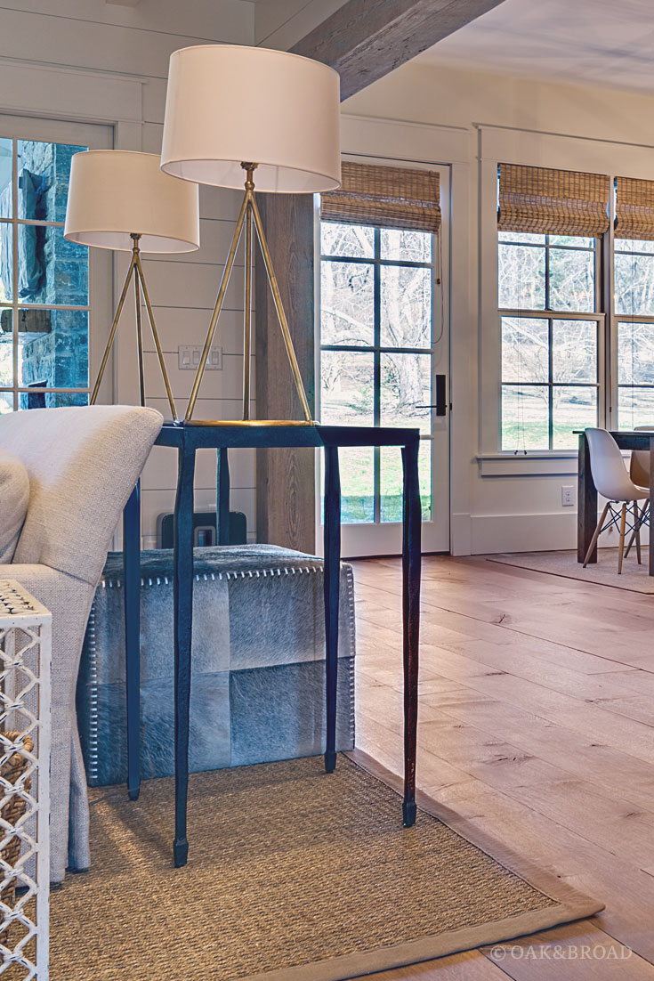 Wide Plank White Oak Hardwood Floor by Oak and Broad with Custom Stain | Rustic modern details including modern dining chairs and cowhide ottoman