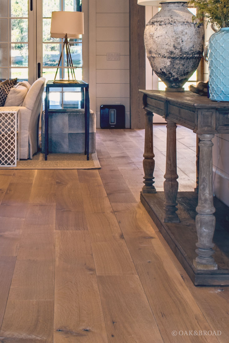 Wide Plank White Oak Hardwood Floor by Oak and Broad with Custom Stain | detailed view into living room of charming southern home