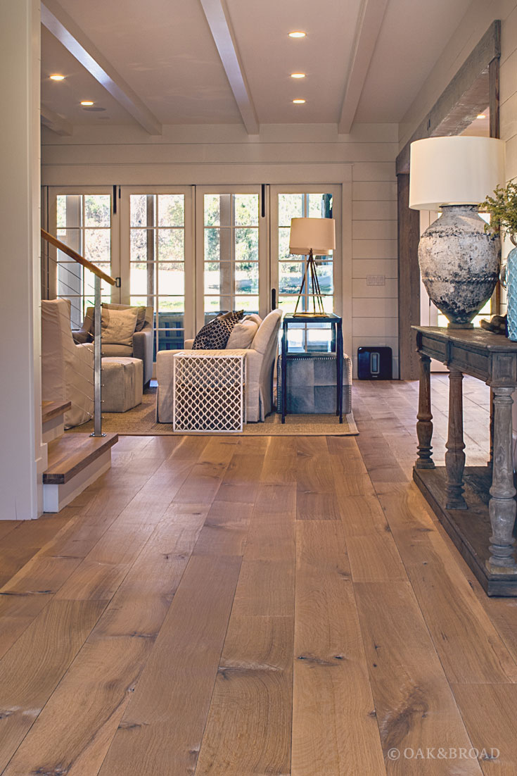 Wide Plank White Oak Hardwood Floor by Oak and Broad with Custom Stain | View into living room of charming southern home
