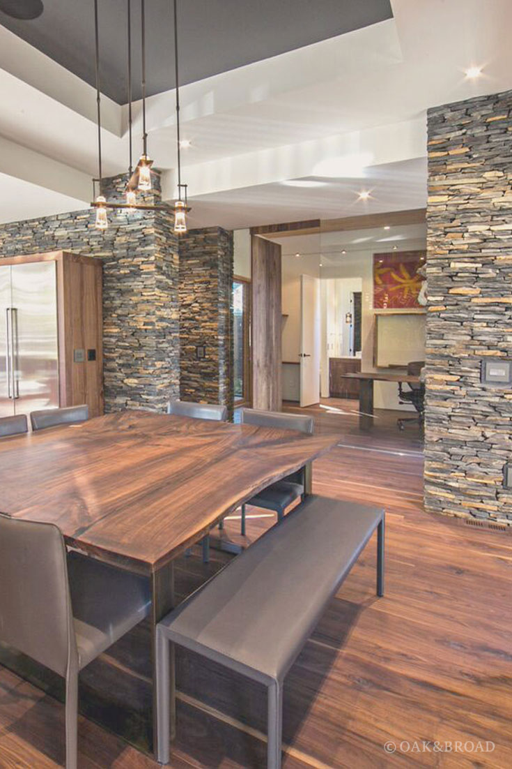 Wide Plank Black Walnut Hardwood Floor by Oak and Broad | Modern kitchen and dining area in matching black walnut with stone accents