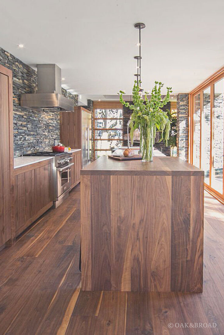 Wide Plank Black Walnut Hardwood Floor by Oak and Broad | Modern kitchen with matching black walnut woodwork