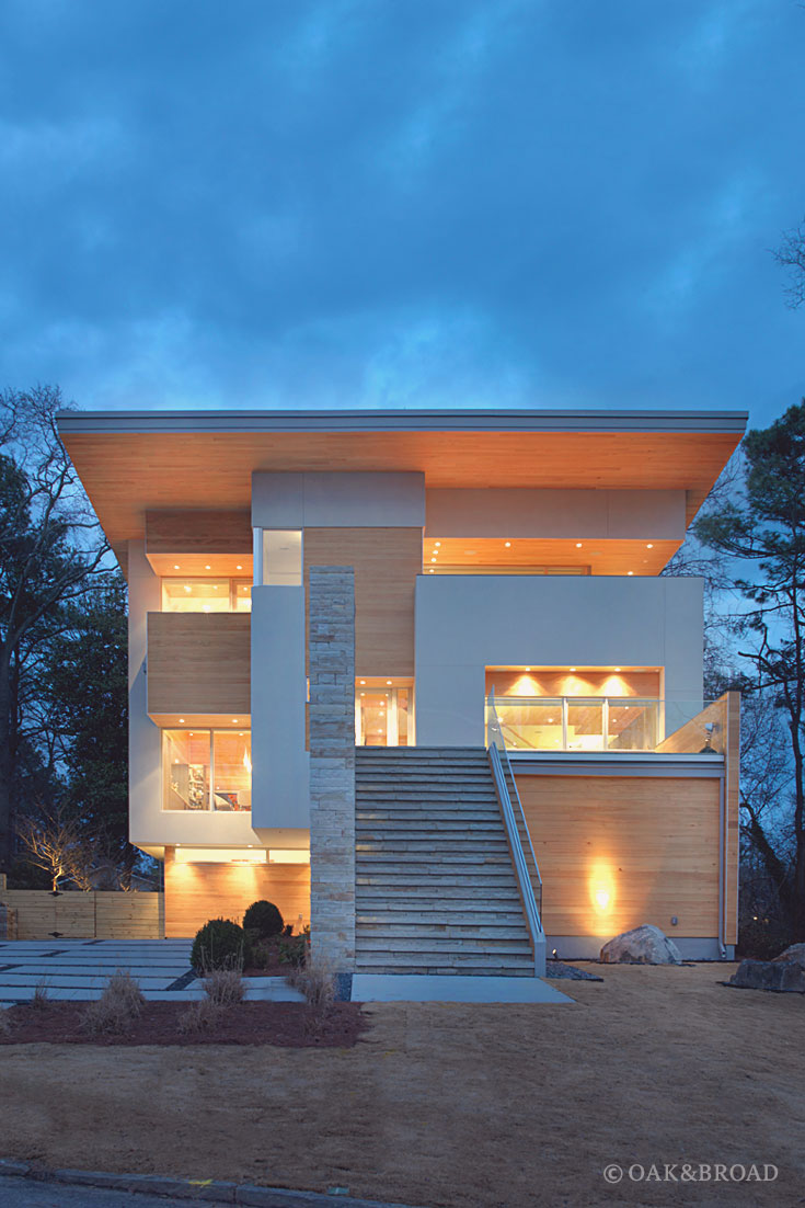 Wide Plank Hardwood Floor by Oak and Broad | Exterior shot of modern home at night
