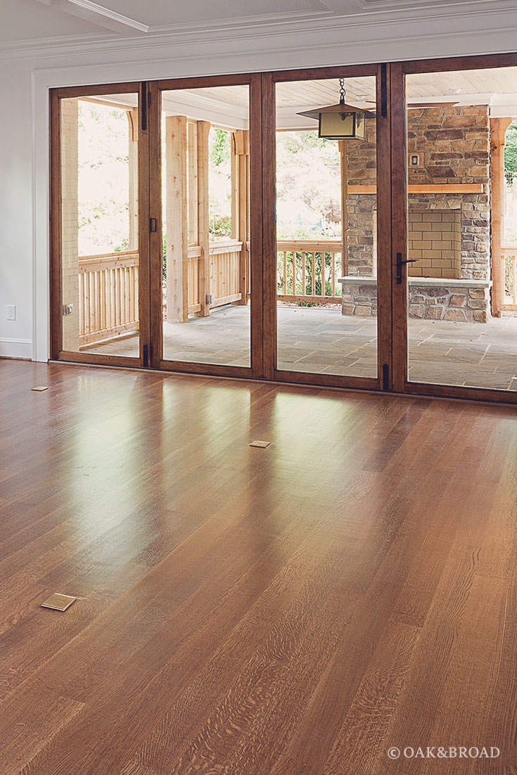 Wide Plank White Oak Floor By Oak And Broad | Select & Better Rift & Quartered | Looking out toward the patio