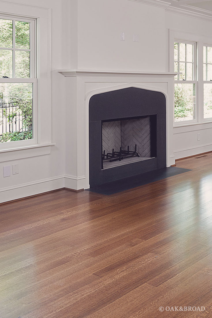 Wide Plank White Oak Floor By Oak And Broad | Select & Better Rift & Quartered | Fireplace with decorative moulding