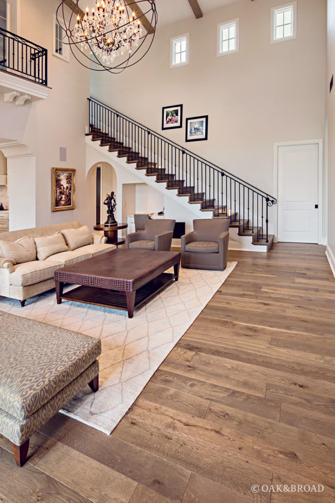 Custom wide plank hardwood floor by Oak & Broad in living room of Arizona Home