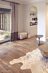Custom wide plank hardwood floor by Oak & Broad in living room of Arizona Home