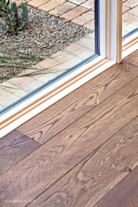 Close up of custom wide plank floor by Oak & Broad