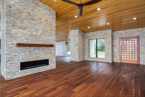 living room in modern home with black walnut wide plank floor by Oak & Broad