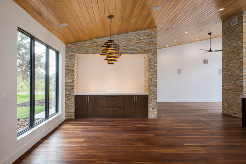 living room in modern home with black walnut wide plank floor by Oak & Broad