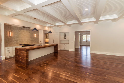 Living room and kitchen with Black Walnut floor by Oak & Broad