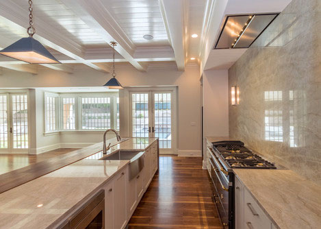 Galley style kitchen with Black Walnut floor by Oak & Broad